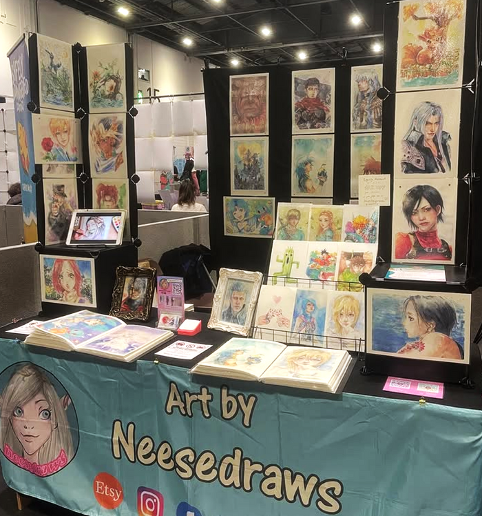 A glimpse of a typical NeeseDraws Artist Alley setup.